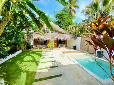 a villa with a swimming pool and a resort at Villa Tortuga, Guest house Private bungalow, private pool in Las Terrenas
