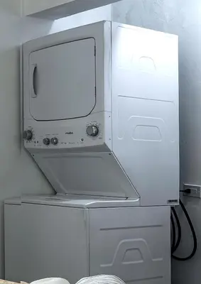 a white microwave oven sitting on top of a shelf at Kite Beach Oceanfront Two Bedroom Patio and Garden in Cabarete