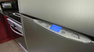 a close up of a refrigerator with a clock on it at Ocean Dream 2bdr/2bth Ground floor in Cabarete