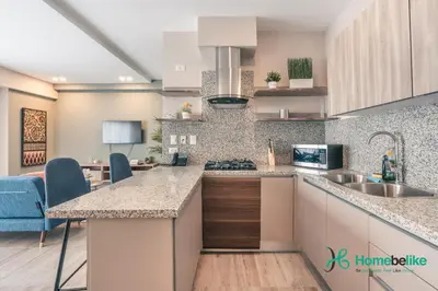 a kitchen with a sink and a counter top at Chic Fully Serviced Apartment at Regatta Living II - 705 in Los Prados