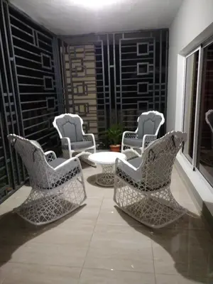 a group of chairs and a table on a balcony at Cabrera Family Villa in Cabrera