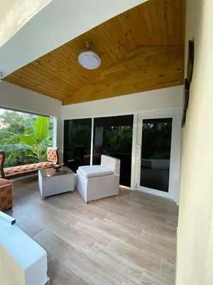 a large living room with a wooden ceiling at Villas Don Che, 2 villas in Jarabacoa