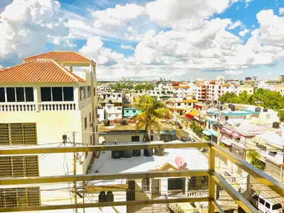 a view of a city from a balcony at LA VlTA E' BELLA in Los Mameyes