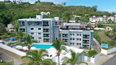 an aerial view of a resort with palm trees at Skylight Suites Hotel in San Felipe de Puerto Plata