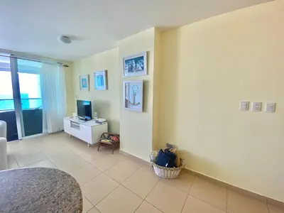 a living room with a desk and a television at 707 Marbella 2bedroom Beachfrom Apt in San Pedro de Macorís
