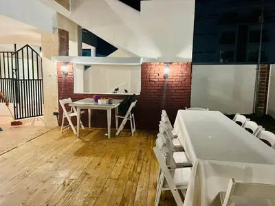 a dining room with a table and white chairs at Noe Hotel ,1 Bed Room 2 Near to the beach in Punta Cana