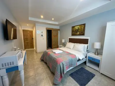 a bedroom with a bed and a desk and a sink at Noe Hotel ,1 Bed Room 2 Near to the beach in Punta Cana