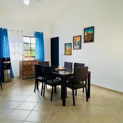 a dining room with a table and chairs at Hispaniola 3 bed, 3 bath Villa with pool & jacuzzi in Sosúa