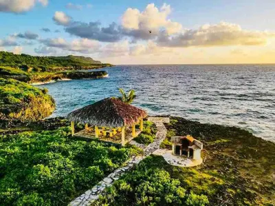 an aerial view of a resort on the ocean at PALM HOUSE - LUXURY VILLA - SAMANÁ - Ocean Front in Sánchez