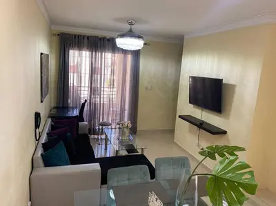 a living room with a couch and a table at Lesnah Apartamento, Jacobo Majluta in Los Casabes