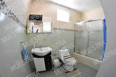 a small bathroom with a sink and a toilet at Apartamento en la carreras próximo al monumento in Santiago de los Caballeros