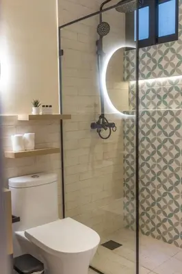 a bathroom with a toilet and a shower at Casa Adefra Boutique Hotel Zona Colonial in Santo Domingo