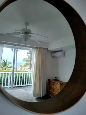 a mirror in a room with a view of a balcony at Perfect Paradise, Oceanview in Samana in Santa Bárbara de Samaná