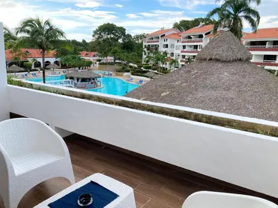 a balcony with a view of a swimming pool at Flat Anchor Marine Monte Vista in Sosúa