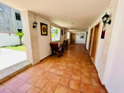 a hallway with a tiled floor in a house at Noé Hotel ,1 Bedroom # 5 near to the beach in Punta Cana