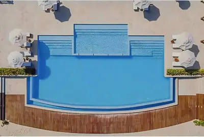 a rendering of a blue screen on a wall at Cana Rock Condos Familiar - Two apartments very close-Ground floor direct access to the pool in Punta Cana