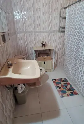 a bathroom with a sink and a toilet at La Casita de Mary in Santa Cruz de Barahona
