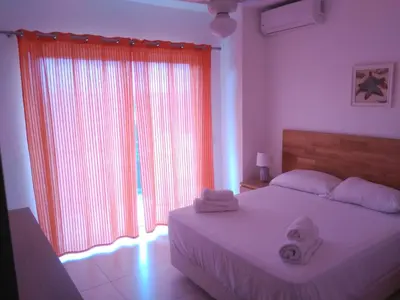 a bedroom with a bed with two towels on it at Maggy's House in La Romana