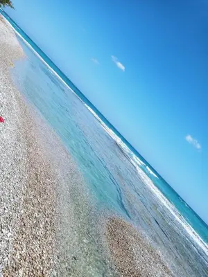 an aerial view of a beach with clear water at Local vacation beach house in Santa Cruz de Barahona