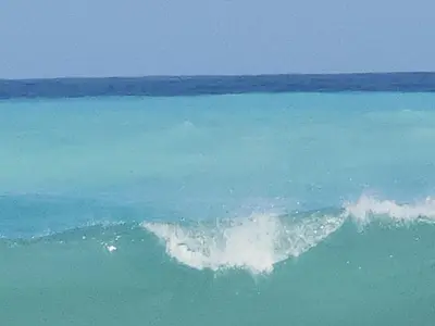 an aerial view of a wave in the ocean at Beachfront Apartment, Quiet 4 Beds, 1 Bath, AC, Wi-Fi, Hot Water, in Paraiso near Los Patos in Paraíso