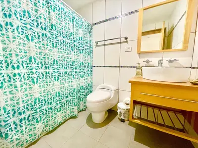 a bathroom with a toilet and a sink at Marbella 2bedroom Beachfront Apartment in San Pedro de Macorís