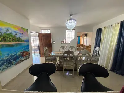 a dining room with a table and chairs at Santiago Center Huge Apartment 2stay rooftop to enjoy the city view 6-3 in Santiago de los Caballeros