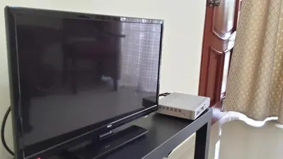 a flat screen tv sitting on top of a table at Costambar in San Felipe de Puerto Plata