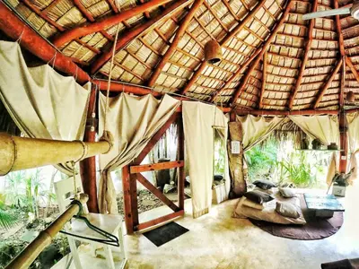 a room with an open door in a hut at Jungle Hut near Beach - Nature Lovers in Las Terrenas