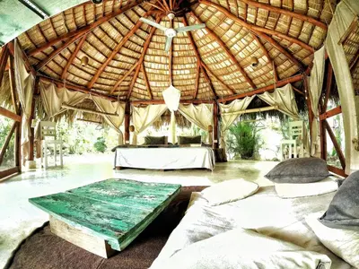a large tent with a table in the middle of a room at Jungle Hut near Beach - Nature Lovers in Las Terrenas