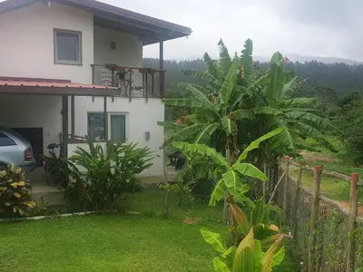 a house with a view of a yard at Apartamento los 3B in Manabao