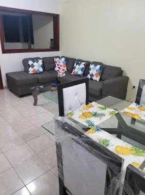 a living room with a couch and tables with pillows at Apartamento acogedor con equipamiento premium in El Café