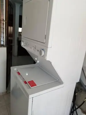 a white stove top oven sitting in a kitchen at Apartamento acogedor con equipamiento premium in El Café