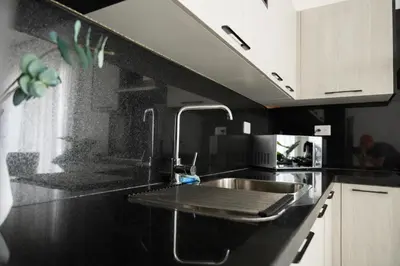 a kitchen counter with a sink and a sink at Luxurious and Spacious Condo in Santiago de los Caballeros