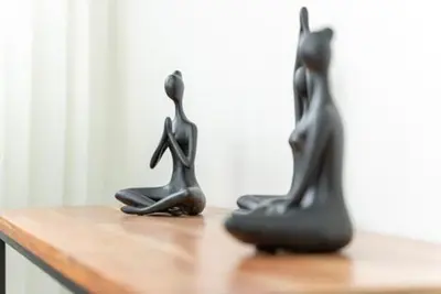 two black animal statues sitting on a wooden table at Luxurious and Spacious Condo in Santiago de los Caballeros