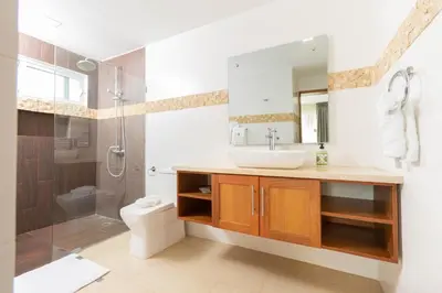a bathroom with a sink and a shower and a toilet at Amazing Ocean Front - 2 bedroom Apartment (117 sq meters) in Cabarete