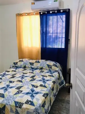 a bedroom with a bed and a window at Apto 2Habitaciones con Aire y Vista al Malecón de Samaná in Santa Bárbara de Samaná