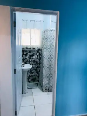 a bathroom with a toilet and a sink at Apto 2Habitaciones con Aire y Vista al Malecón de Samaná in Santa Bárbara de Samaná