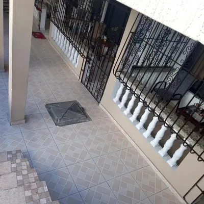 a hallway with stairs and a tile floor at hospedaje de marant 2 in San Felipe de Puerto Plata