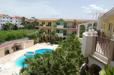 an apartment with a swimming pool in a building at Espectacular BZII, bayahibe in Bayahibe