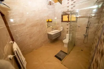 a bathroom with a shower with a sink and a toilet at ωιℓℓу'ѕ νιℓℓα in Jarabacoa