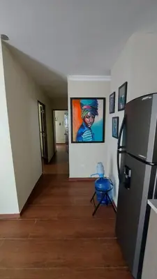a hallway in a house with a painting on the wall at Casa Kamanda, Zona Colonial, Santo Domingo in Santo Domingo