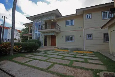a large house with a patio in front of it at Super Spacious 4BR 4 5BA Villa w pool in Sosua in Sosúa