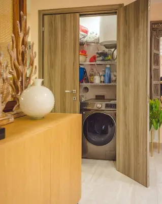 a kitchen with a washer and a washing machine at Hard Rock Area PH • Private Jacuzzi + Beach Views in Punta Cana