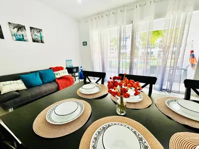 a living room with a table and a couch at My Dominicus Beach Retreat in Bayahibe