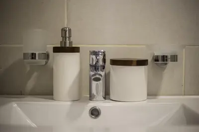 two rolls of toilet paper sitting on top of a sink at New Beachfront Penthouse in Las Terrenas
