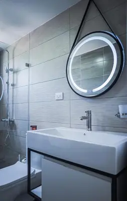 a bathroom with a white sink and a mirror at Hermosa townhouse boca paraíso in Boca Chica