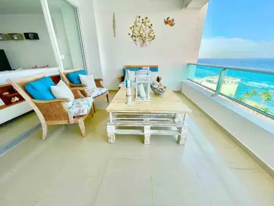 a living room with a view of the ocean at 3 Bedrooms At Marbella Beachfront Juan Dolio in Juan Dolio