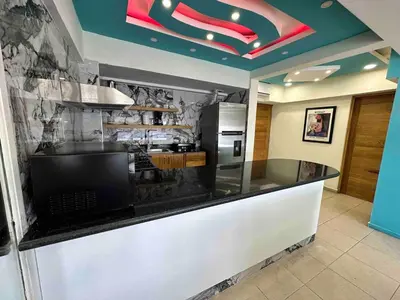 a kitchen with a counter with a krispy kreme sign at Villa Marbella by Potenza Rentals in Santo Domingo