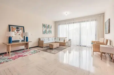 a living room with a couch and a table at Beautiful 2 BR apartment at Portillo in Las Terrenas