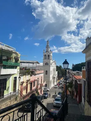 a view of a city street with a clock tower at VBermor Hotel in Santo Domingo